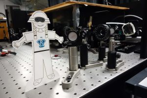 Flat Rosie aligning a laser with the ultrafast dynamics group