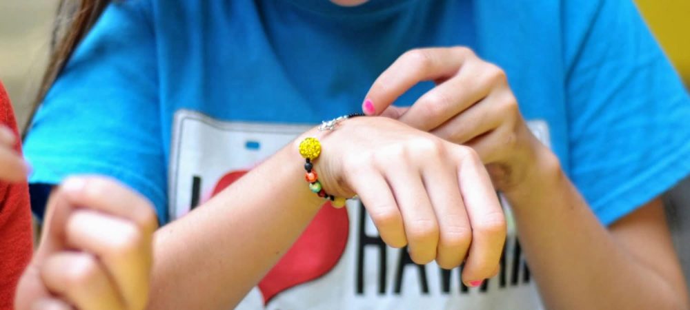 solar system bracelet on girls hand