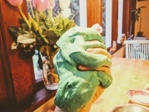 fluffy slime making 1 - hand squeezing green slime leaving clear imprints