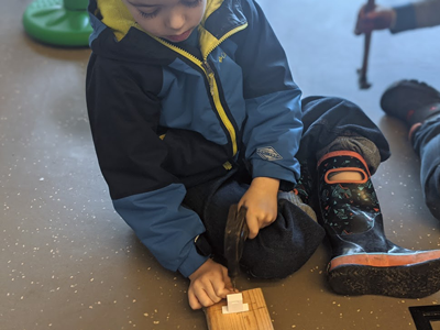 student adds 3d printed popsicle stick holder as a release for the 3d printe ping pong ball launcher