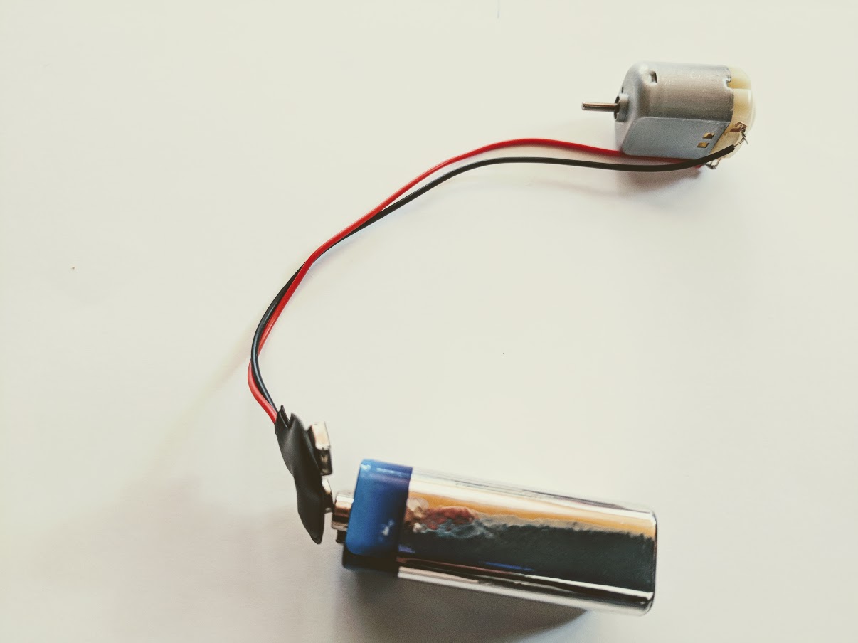 testing the dc motor and battery in a simple recycled robot craft